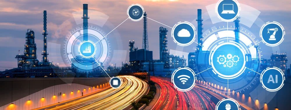 Industrial plant at dusk overlaid with connected technology icons